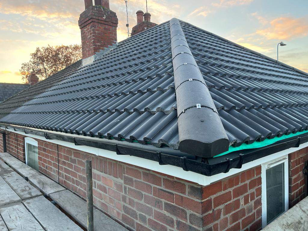 Completed pitched roof with tiles on a house